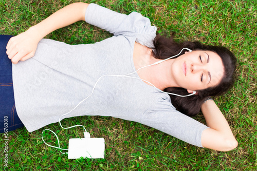 Photo: Relaxed woman listening music Relaxed woman listening music