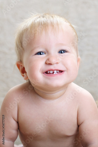 Photo: portrait of a joyful child on a light background portrait of a joyful child on a light background