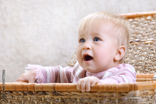 Photo: laughing baby in a basket laughing baby in a basket
