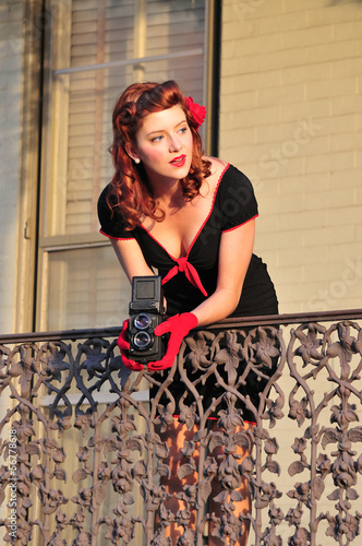 Photo: lady using vintage camera lady using vintage camera
