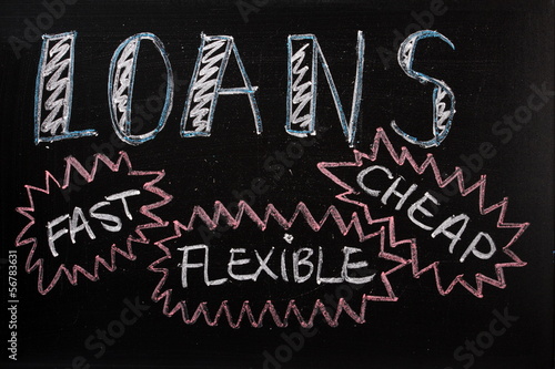 Photo: Loans advertised on a blackboard sign Loans advertised on a blackboard sign