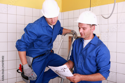 Photo: Electricians working together Electricians working together