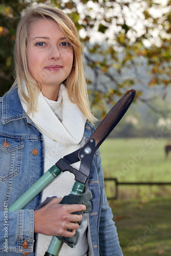 Photo: Woman with a pair of garden shears Woman with a pair of garden shears