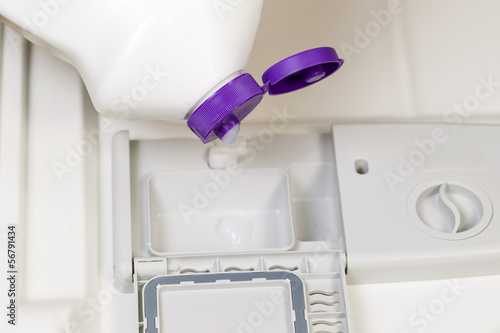 Photo: Adding Detergent to Dishwasher Adding Detergent to Dishwasher