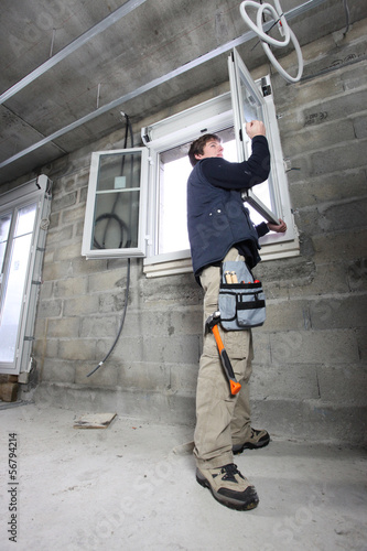 Photo: Man fitting double glazing Man fitting double glazing