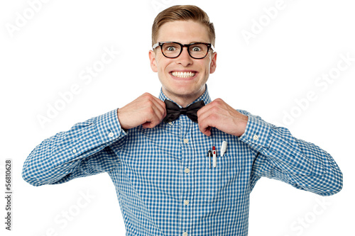 Photo: Nerd guy adjusting his bow tie Nerd guy adjusting his bow tie