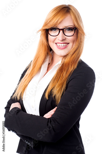 Photo: Confident young female executive Confident young female executive