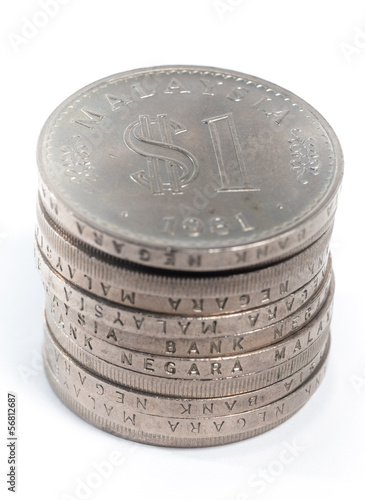 Photo: Old Malaysia Coin stacked on a white background Old Malaysia Coin stacked on a white background