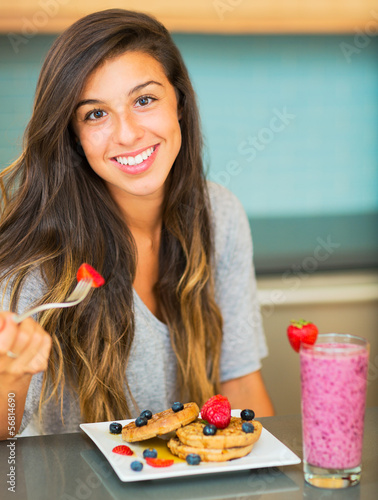Photo: Woman Eating Breakfast Woman Eating Breakfast