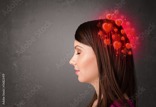 Photo: Young person thinking about love with red hearts Young person thinking about love with red hearts