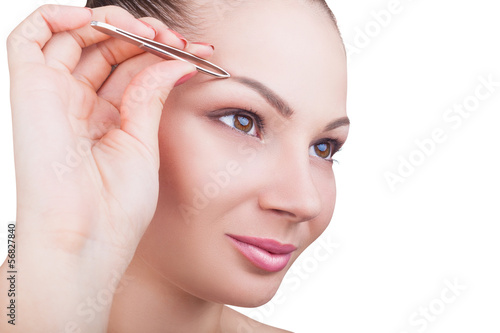 Photo: Plucking eyebrows Plucking eyebrows