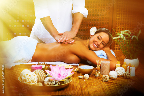 Photo: Beautiful woman having massage. Beautiful woman having massage.
