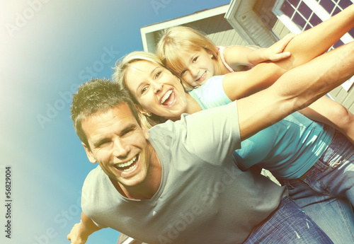 Photo: Happy family near the house Happy family near the house