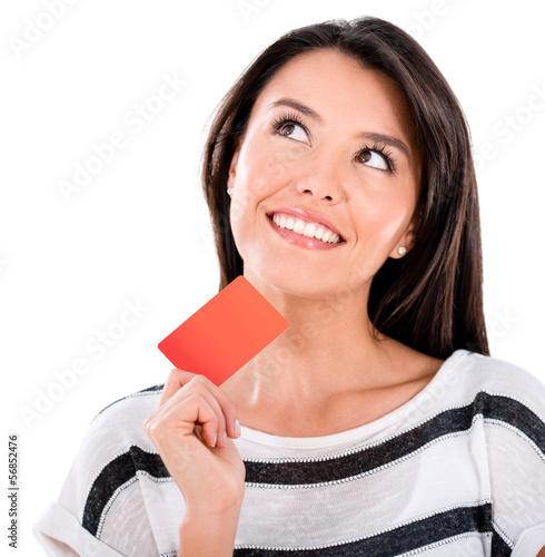 Photo: Thoughtful woman with a credit card Thoughtful woman with a credit card