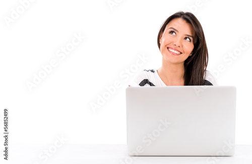 Photo: Thoughtful woman with a laptop Thoughtful woman with a laptop