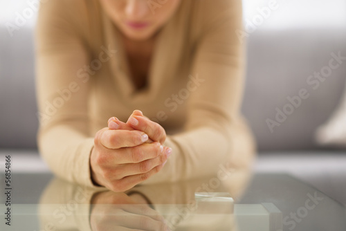 Photo: Closeup on hands of stressed young housewife Closeup on hands of stressed young housewife
