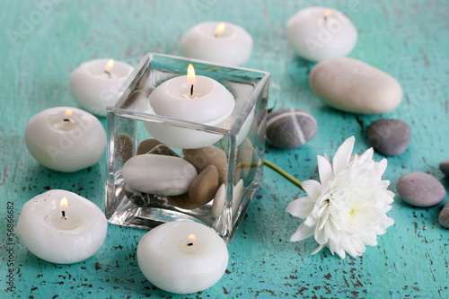 Photo: Decorative vase with candles, water and stones Decorative vase with candles, water and stones