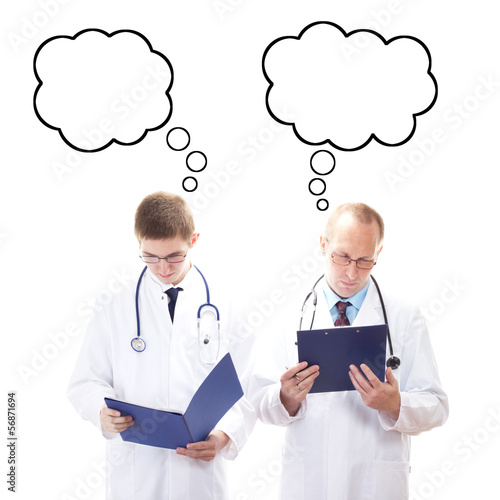 Photo: Two male doctors thinking about something Two male doctors thinking about something