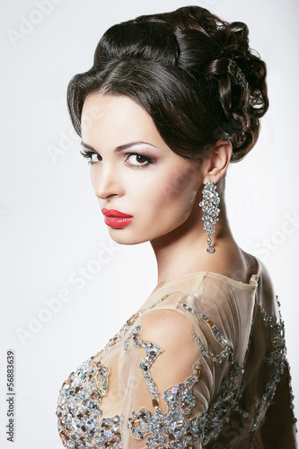 Photo: Prosperity. Luxury. Glamorous Showy Woman with Diamond Earrings Prosperity. Luxury. Glamorous Showy Woman with Diamond Earrings
