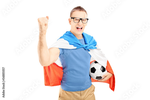 Photo: Euphoric male fan holding a soccer ball and flag of Holland Euphoric male fan holding a soccer ball and flag of Holland