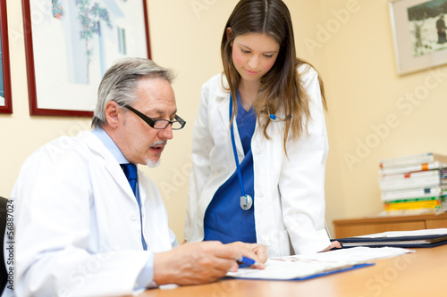 Photo: Doctor and his assistant in the studio Doctor and his assistant in the studio