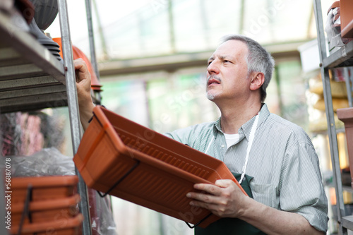Photo: Greenhouse employee Greenhouse employee