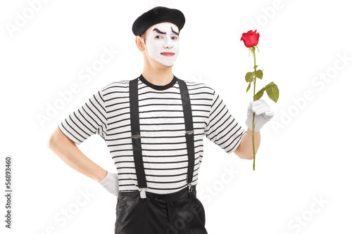 Photo: Male mime artist holding a rose flower Male mime artist holding a rose flower