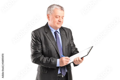 Photo: Mature businessman looking at documents Mature businessman looking at documents
