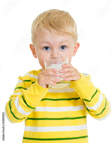 Photo: Kid boy drinking yoghurt from glass Kid boy drinking yoghurt from glass