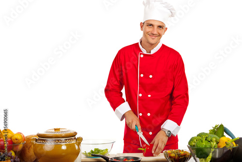 Photo: Happy chef cutting pepper Happy chef cutting pepper