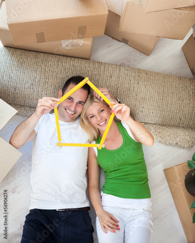 Photo: Couple enjoying in new house Couple enjoying in new house