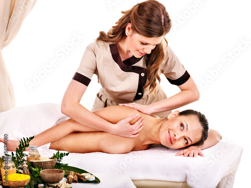 Photo: Woman getting spa lastone therapy outdoor. Woman getting spa lastone therapy outdoor.
