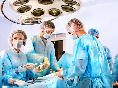 Photo: Surgeon at work in operating room. Surgeon at work in operating room.