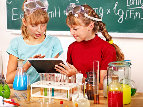 Photo: Child in chemistry class. Child in chemistry class.