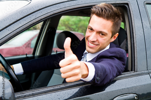 Photo: Happy man in his new car Happy man in his new car