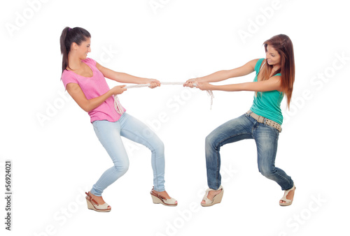 Photo: Two beautiful women pulling a rope Two beautiful women pulling a rope