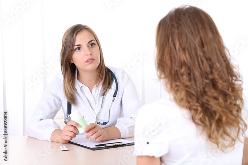 Photo: Doctor and patient at office Doctor and patient at office
