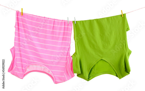 Photo: Clothes on rope isolated on white Clothes on rope isolated on white