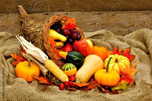 Photo: Harvest or Thanksgiving cornucopia filled with vegetables Harvest or Thanksgiving cornucopia filled with vegetables
