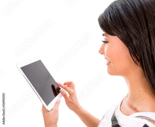 Photo: Woman using app on a tablet Woman using app on a tablet