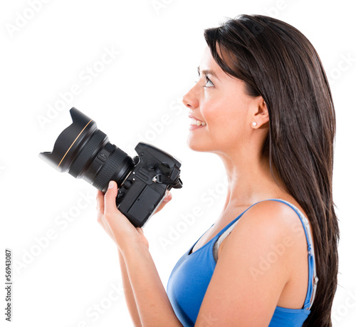 Photo: Woman holding a camera Woman holding a camera
