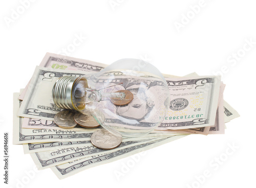 Photo: common lamp bulb on dollars common lamp bulb on dollars