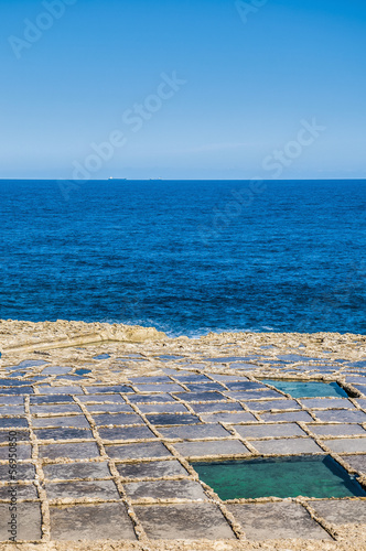 Photo: Salt pans near Qbajjar in Gozo, Malta. Salt pans near Qbajjar in Gozo, Malta.