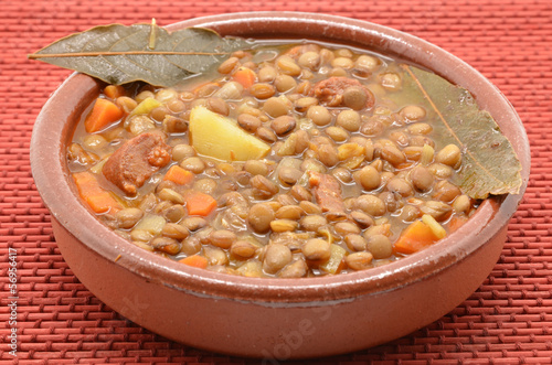 Photo: Brown lentil stew in bowl with vegetable Brown lentil stew in bowl with vegetable