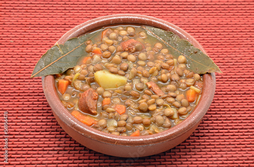 Photo: Brown lentil stew in bowl with vegetable Brown lentil stew in bowl with vegetable