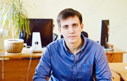 Photo: man in office man in office