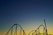 Roller coaster against setting sun Roller coaster against setting sun