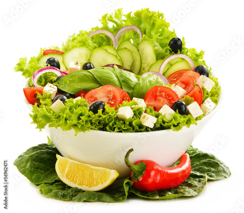 Photo: Vegetable salad bowl isolated on white Vegetable salad bowl isolated on white