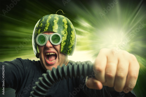 Photo: Bizarre man in a helmet from a watermelon Bizarre man in a helmet from a watermelon