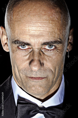 Photo: Intensive Close-up bold mature man portrait color image Intensive Close-up bold mature man portrait color image